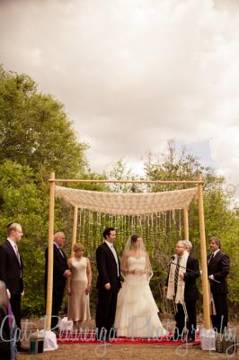 Bride and Groom at alter. Bride in Anjolique Bridal